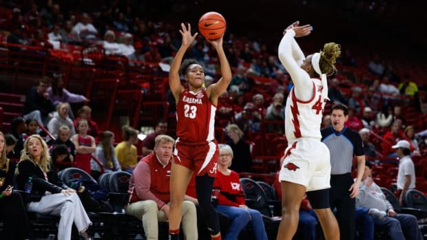 Alabama Guard Brittany Davis (23) shoots a three against Arkansas at Bud Walton Arena in Fayetteville, AR on Thursday, Jan 26, 2023.